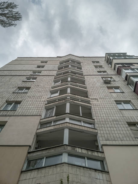 istock Old multi-storey highrise residential building with broken windows.. 1399029225