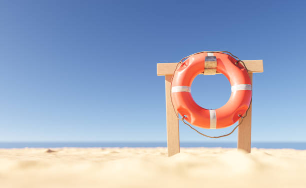 стойка со спасательным кругом на пляже - ring buoy стоковые фото и изображения