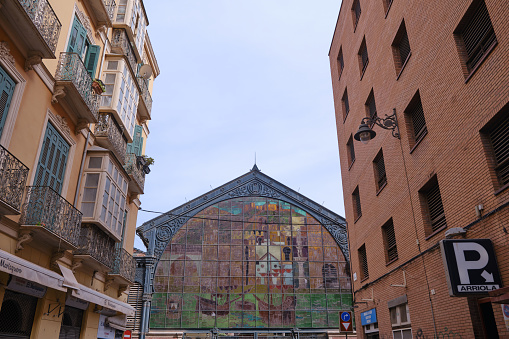MALAGA, SPAIN - May 19, 2022: Mercado Central de Atarazanas in the old town of Malaga seen from Atarazanas street