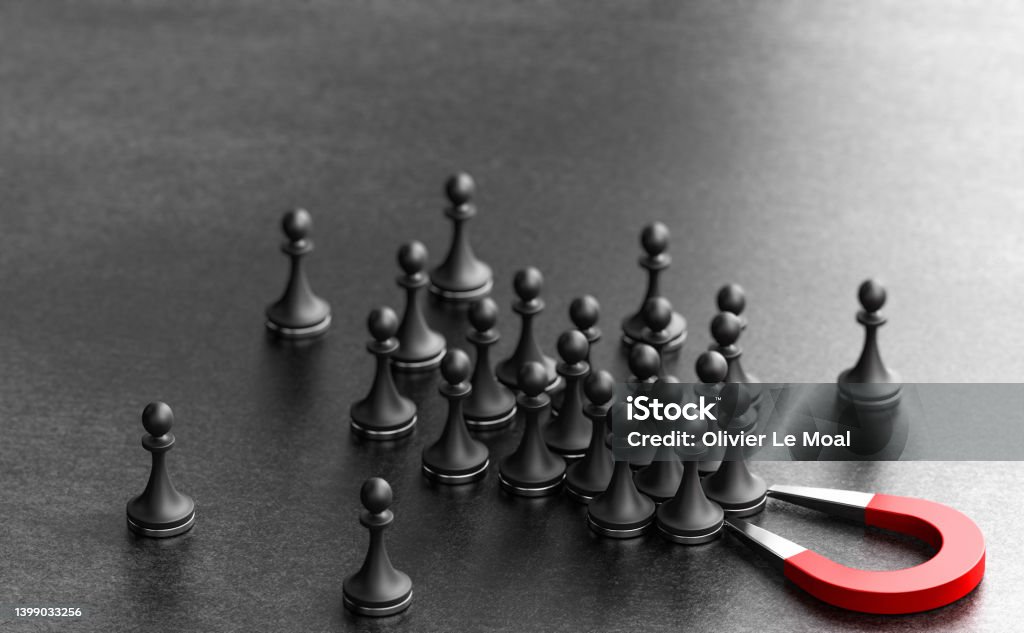 Lead Acquisition. Inbound Marketing Concept. Horseshoe magnet attracting pawns over black background. Concept of inbound marketing. Attraction, engagement and conversion of new leads. 3d illustration. Employee Retention Stock Photo