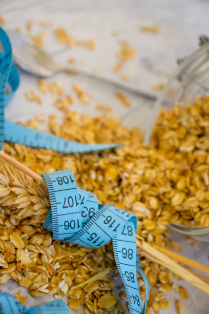 istock Dry oatmeal measuring tape on old background 1399034541