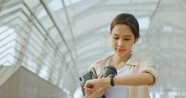 istock Asian businesswoman using Bluetooth headphones for conferences while commuting in transportation to work with happy smile. women use urban transport routes free internet technology in the city 1399036740