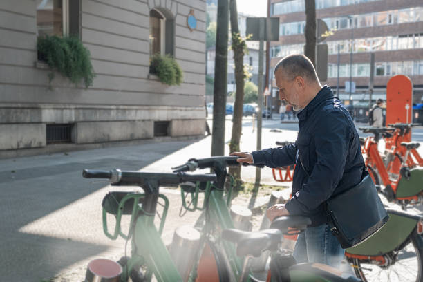istock Mature man rents a bicycle 1399037640