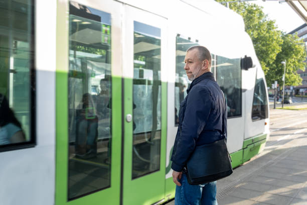istock Mature man, at the tram stop 1399037641