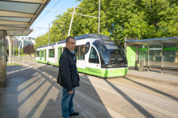 istock Mature man, at the tram stop 1399037645