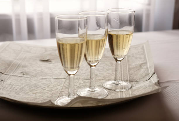 istock Three glasses of chmpagne on table at restaurant 1399040605