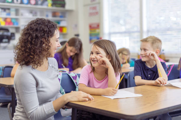 istock Happy student receiving help from their teacher 1399040788