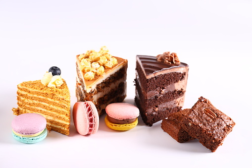 assortment of cakes desserts on white background