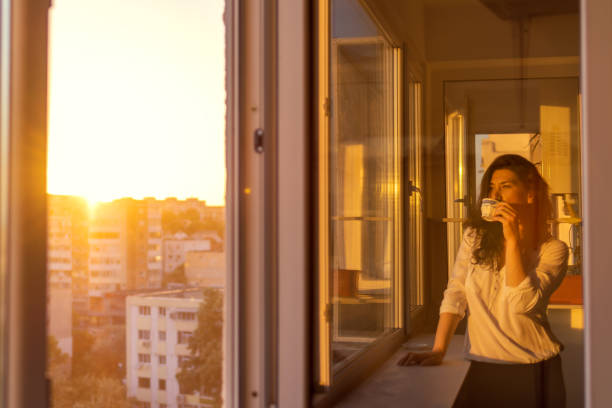 istock Young women enjoying the coffee with sunset 1399041657