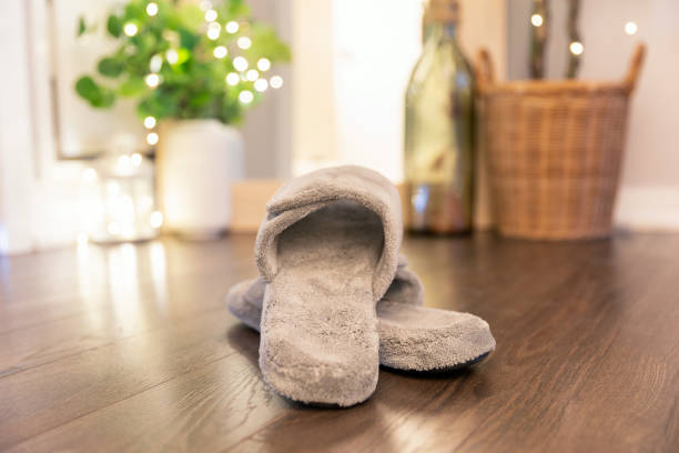 istock Women's comfortable slippers on a hardwood floor. 1399042975
