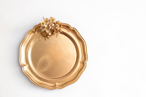 istock round golden tray with metallic flower isolated on  white 1399043335