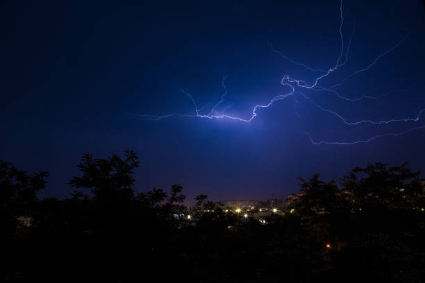 istock Lightning discharges over the city. A summer thunderstorm at night. 1399044542