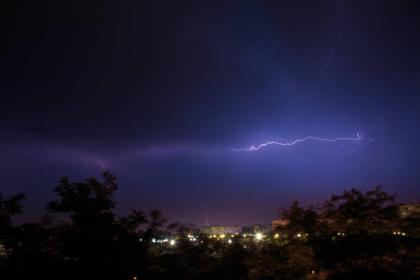 istock Lightning discharges over the city. A summer thunderstorm at night. 1399044553