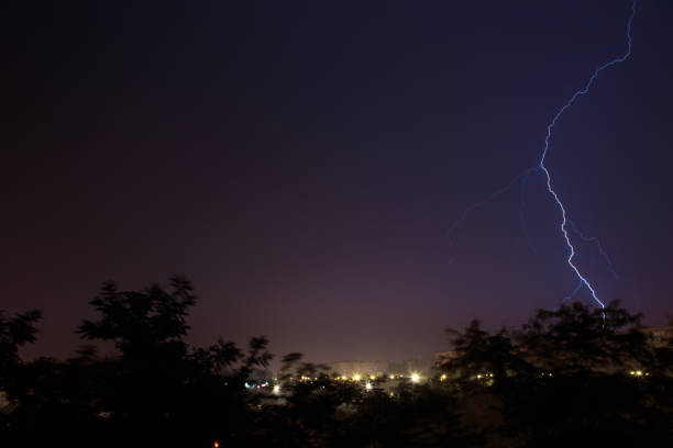istock Lightning discharges over the city. A summer thunderstorm at night. 1399044558