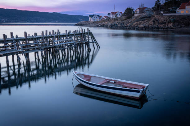 istock A small white boat docked in the port, sunset 1399046132