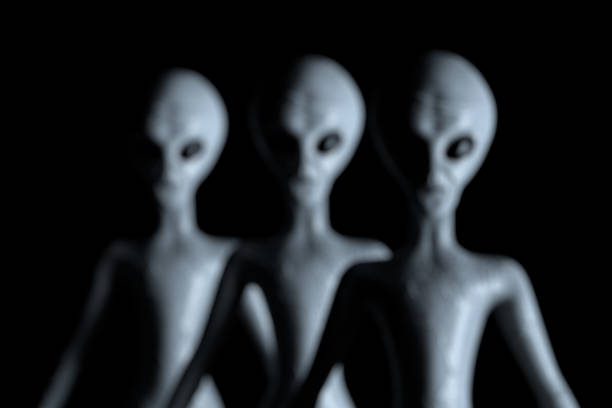 istock Blurred Background Row of Scary Gray Humanoid Aliens. 3d Rendering 1399046923