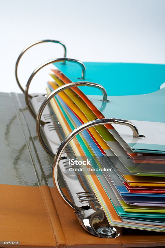 Close-up of binder with stacked files Binder closeup with files stacked (small DOF) Handbook Stock Photo