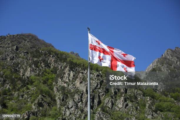 Georgian Flag Flutters In The Wind On A Sunny Day Stock Photo - Download Image Now - Georgia - Country, Flag, Tbilisi