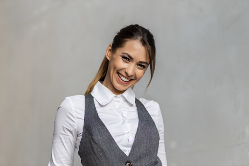 Portrait of a beautiful young businesswoman at work. Young woman in business wear. Gorgeous woman smiling.