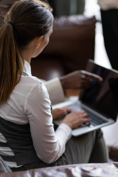 istock Young businesswoman typing on laptop 1399048199