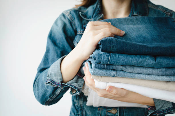 istock Woman Holding Jeans 1399049797