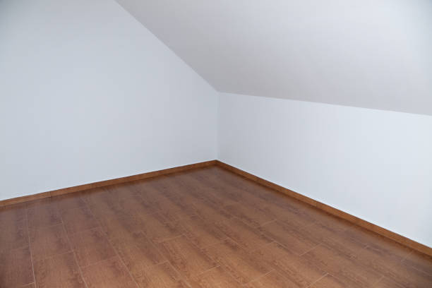 istock Empty loft or attic, wooden floor, white walls 1399049841