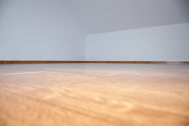 istock Empty loft or attic, wooden floor, white walls 1399049902