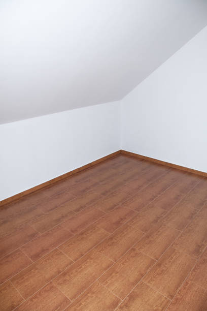istock Empty loft or attic, wooden floor, white walls 1399049913