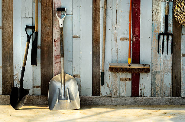 istock Gardening tool Hang on a blue old wall 139905007