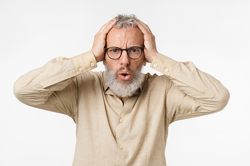 Scared shocked sad caucasian mature middle-aged man freelancer in glasses crying shouting with fear isolated in white background