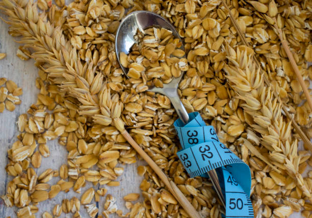 istock Dry oatmeal measuring tape on old background 1399052968