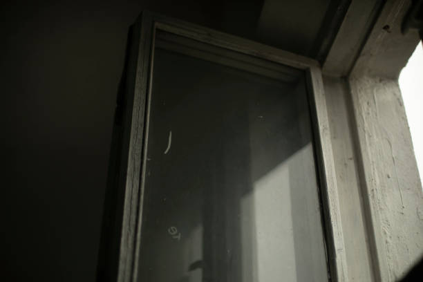 istock Old window. Wooden frame and glass. Interior details. 1399054827