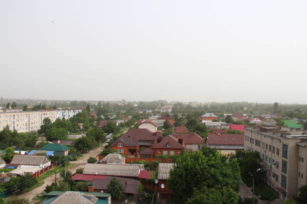Dust storm over the city and the dust pollution