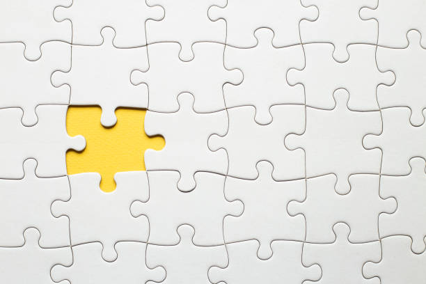istock Top view flat lay of paper plain white jigsaw puzzle game texture incomplete or missing piece, studio shot on a yellow background, quiz calculation concept 1399055129