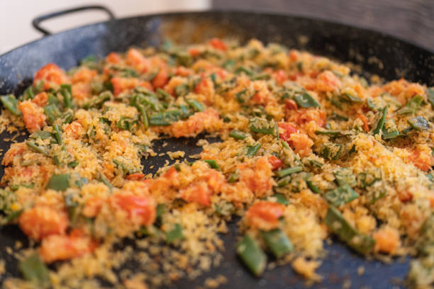 Preparing the real paella with seafood from Valencia