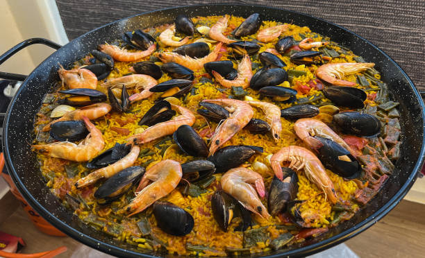 istock Preparing the real paella with seafood from Valencia 1399056112