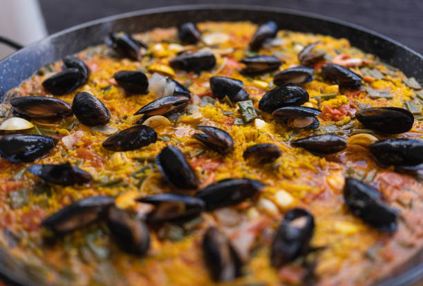 Preparing the real paella with seafood from Valencia