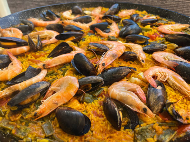 istock Preparing the real paella with seafood from Valencia 1399056130