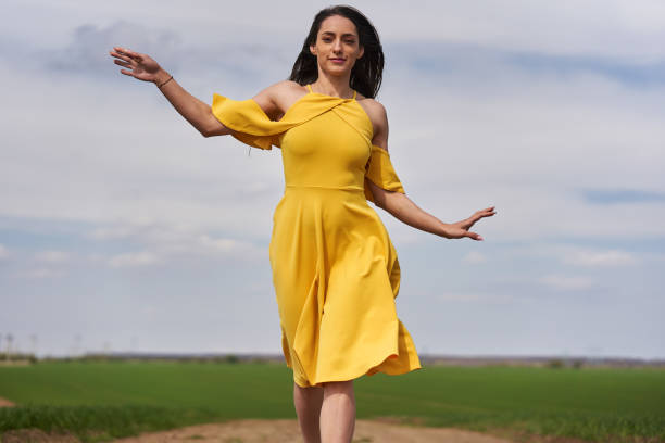 istock Young woman on a dirt road, barefoot 1399059973