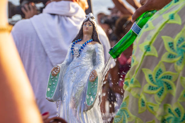 Belém, PA, Brazil - October 13th, 2013: Devout with image of Our Lady of Nazareth during the procession of the Cirio of Nazareth. The course of approximately 5 km brings together hundreds of thousands of people and the Cirio of Nazareth is considered the largest Catholic event of the world.