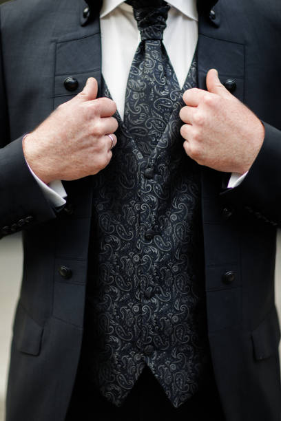 istock Elegance male hands wearing modern black suit 1399062307