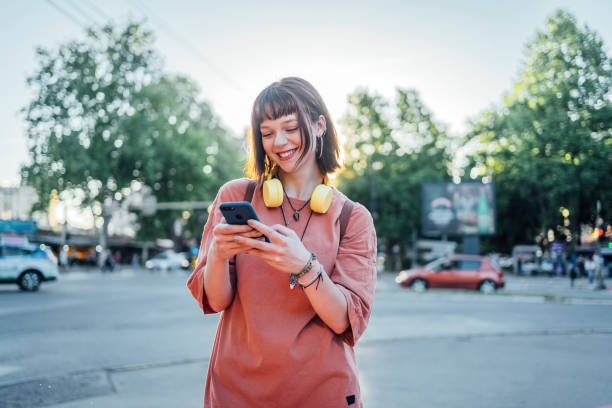istock Woman using phone outdoor 1399064368