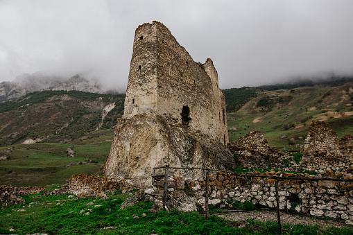 Old ruined castle Frigate in the misty mountains