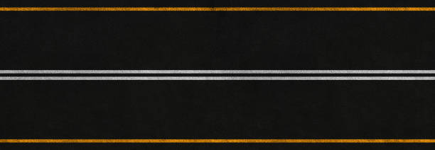 istock panoramic asphalt road with white and yellow marking stripes 1399066428