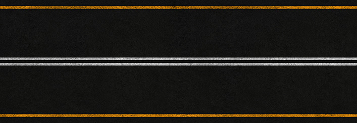 panoramic asphalt road with white and yellow marking stripes