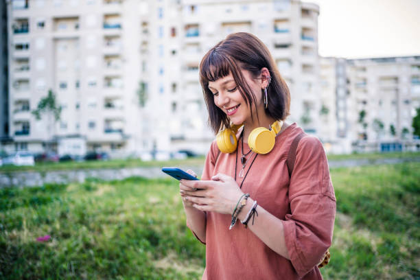 istock Woman using smartphone outdoor 1399066500