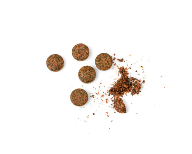 istock Pressed Brown Pills Isolated 1399066798