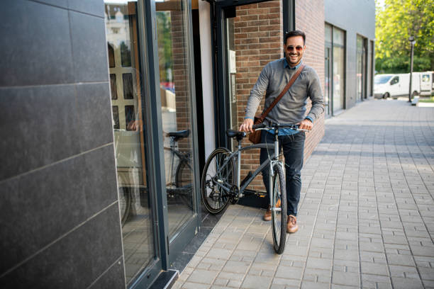 istock Young businessman going to work by his bike 1399071506