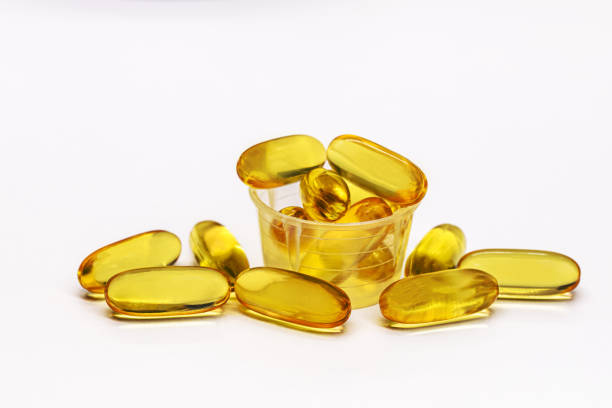 istock omega 3 capsules or tablets in dose meter, isolated white background, fish oil based vitamin, helps reduce bad cholesterol and triglycerides 1399071917