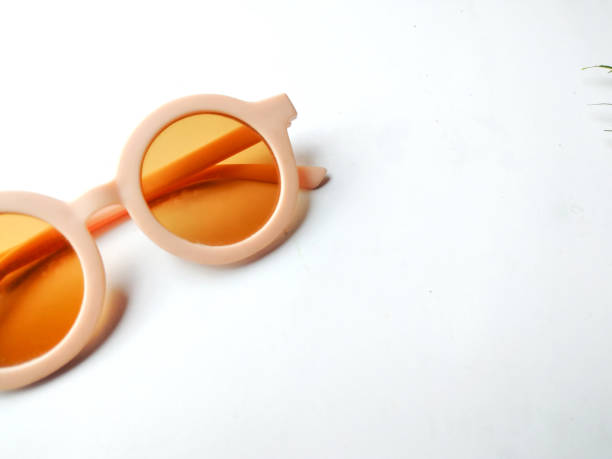 istock Old fashioned sunglasses and brown lens optic on summer object background. 1399072624